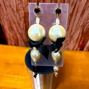 Beautifully made dangle, pearl and Onyx with a black satin bow pierced earrings